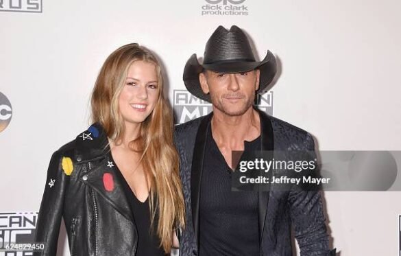 Tim McGraw and Faith Hill with daughter Maggie McGraw at a red carpet event